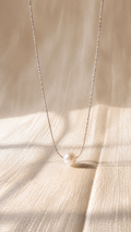 Elegant silver pearl pendant necklace featuring a minimalist white pearl on a delicate anti-tarnish silver chain by Jewel Minimals.