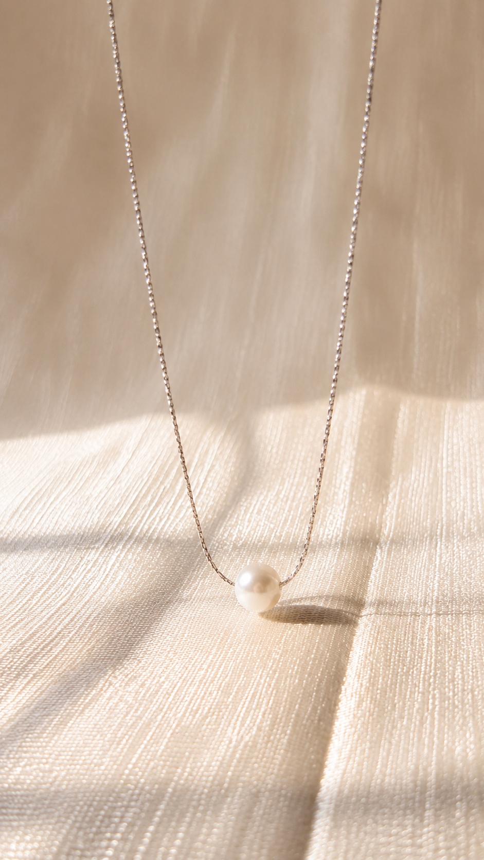 Elegant silver pearl pendant necklace featuring a minimalist white pearl on a delicate anti-tarnish silver chain by Jewel Minimals.